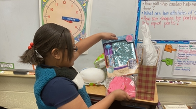 Girl Opening Her Present Photo